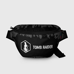 Поясная сумка Tomb Raider glitch на темном фоне: надпись и симво