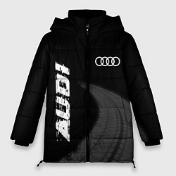 Женская зимняя куртка Audi speed на темном фоне со следами шин вертикаль